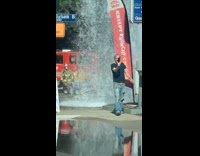 Guy takes video broken fire hydrant firetrucks 