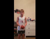 Kid honors Globe Trotters shoots the ball