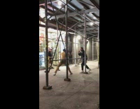 2 guys practice fighting on sidewalk 