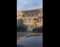 Large skeleton decoration outside apartment building 