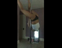 girl on silver pole jumps on it and falls off