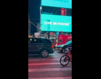 Man push bed wagon on street night