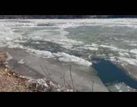 Frozen river cracked sheet of ice winter