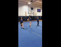 Three girls do a backflip, body rolls on the floor and scorpions
