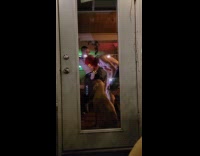 Collab IITW - Two shirtless men dance with door nearby