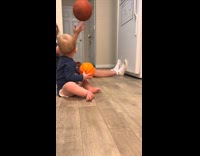 Baby copies guy basketball