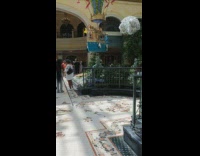 Woman poses in front of fountain in Vegas resort 