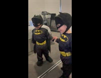 Toddler in Batman Costume Excitedly Checks Itself Out