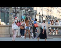 Shirtless guy wears face mask skirt barefoot 