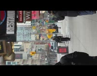 Person walking down sidewalk wears hoop skirt