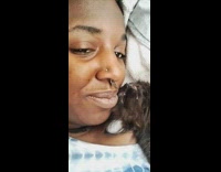 Woman kisses small kitten 