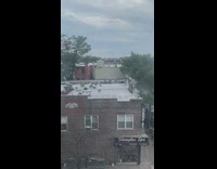 Guy and coach practice boxing on rooftop