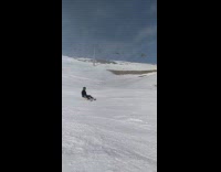 3 snowboarders go down steep mountain 