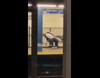 Guy knocks out asleep on subway station bench