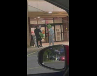 Three guys wear frog helmet enter mall