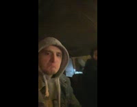 Guy nods head to song while friend raps along 