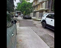 Guy video editing lifts parked black car