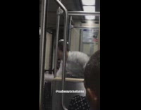 Guy plays with kendama on the subway