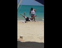 Lady takes selfie with legs wide open at beach 