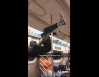 Baby licks subway window green beanie guy 