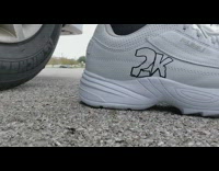 Guy with sharpie 2K shoes shoots basketball and misses hoop on basketball court