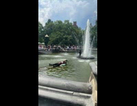 Man on floater at fountain