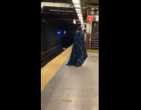Blue plaid blanket ghost costume subway station