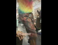 Guy contorts arms and dances on train 