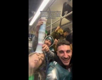 Friends stacked cups at woman while sleeping