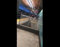 Woman face mask dance stairs train station