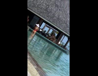 Girl poses pool bar counter floppy hat