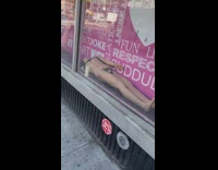 Mannequin without head in store window display 