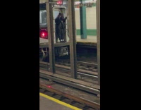 Woman rides at the back of the train 