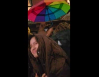 Crowd partying on street while raining