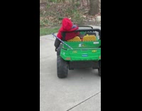 Boy sleeps while driving toy car 