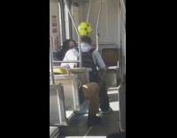 Guy Balances Soccer Ball on Head during Bus Ride 