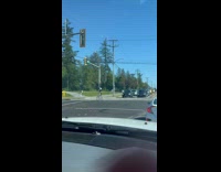 Guy ride tall bike on the street