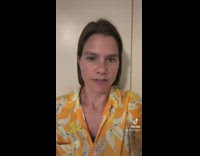 Bartender pours woman a pitcher of beer