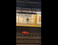 Man destroying wooden pillar planks