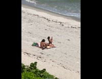 Woman in black bikini twerks butt on the beach