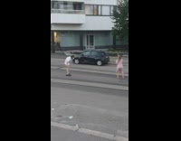 Man removes shorts in the middle of the street