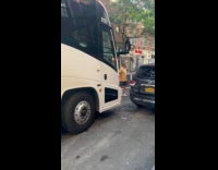 Bus stuck on street with tight space