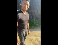 Guy asks friend what is he listening to but friend only makes a face