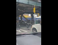 Lady Drags Wheel Machine Down Crosswalk 