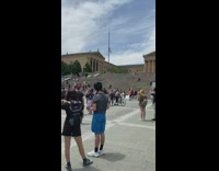 People protest public park photo shoot at top of stairs