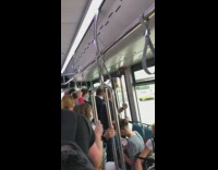 Music blasts in crowded shuttle 