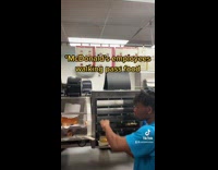 McDonalds employees walking past food 