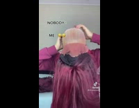 Lady flips wig over to scratch scalp 