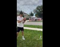 Guy tries to throw football at Delta Gamma 