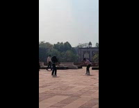 Collab IITW - Woman in green dress tiktok dance in front of the temple